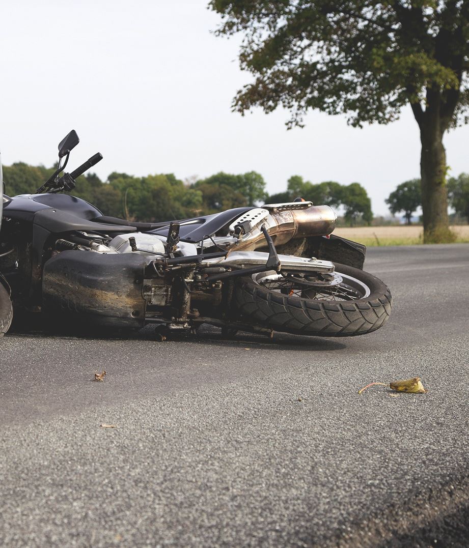 Motorcycle lying on side after accident