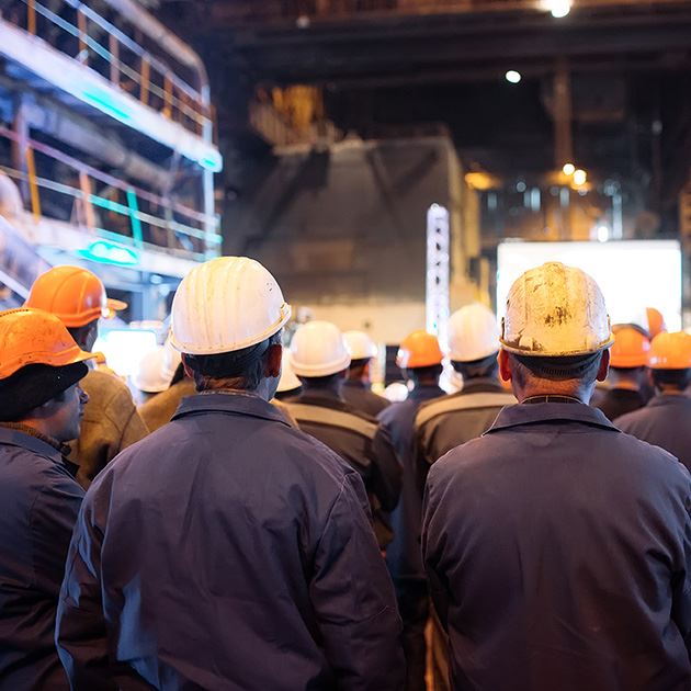 Industrial workers wearing hard hats