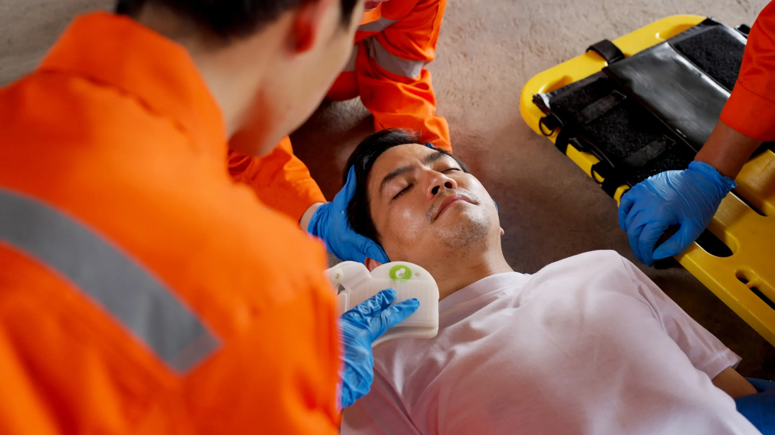 An injured man getting medical attention. 