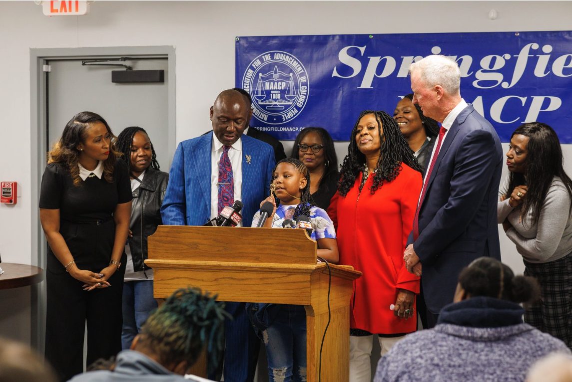Earl Moore Jr's family and attorneys at a press conference.